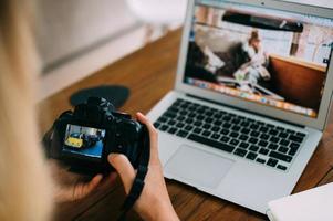 The camera is turned on against the background of a working laptop photo