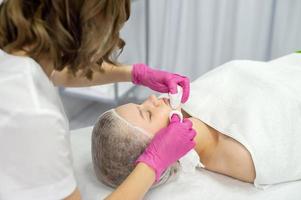 Cosmetic procedure for rejuvenation and cleansing of the skin of the face photo