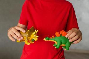 A child plays with animal figures photo