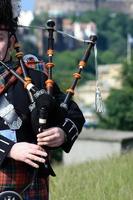 Bagpiper playing in Edinburgh photo