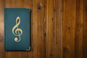 Music book on a wooden desk photo