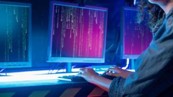 an asian woman programmer is working in her computer room , futuristic technology concept photo