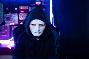 A Hacker is using laptop computer to steal data in the night