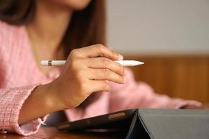 businesswoman hand using computer to analyze sales in order to maximize profits photo