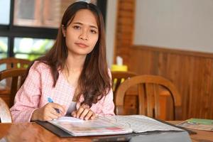 Asian woman with braces ordering food photo