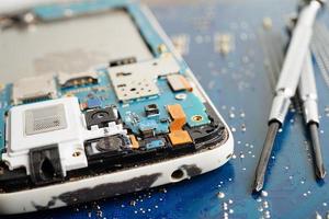 Repairing and upgrade mobile phone, electronic, computer hardware and technology concept. photo