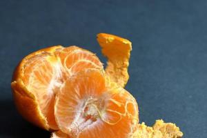 Orange peeled skin on a texture background photo