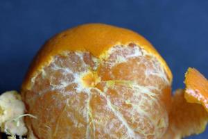 Orange peeled skin on a texture background photo