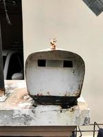 A mailbox that is old and has a lot of rust photo
