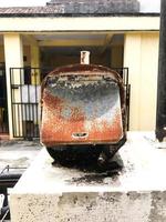 A mailbox that is old and has a lot of rust photo