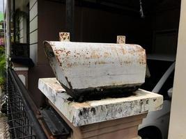 A mailbox that is old and has a lot of rust photo