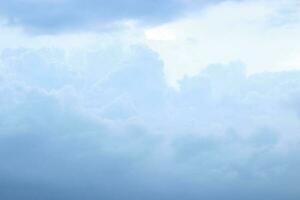 dark blue cloud with white light sky and sun ray with rainbow color reflection background photo