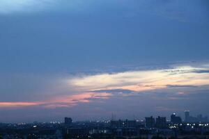 dark blue cloud with white light sunset sky background and city light midnight evening time photo