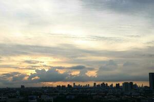 dark blue cloud with white light sun set sky background and city light midnight evening time photo