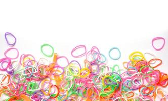 Rubber band - Colorful of plastic band  isolated on white background , top view photo