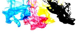 cmyk ink concept color splash for paint with cyan blue red magenta yellow and black - Rainbow ink drop Acrylic colors in water on white background , blur and selective focus photo