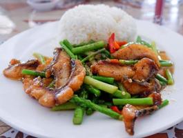 stir fried fish crispy and asparagus cooked rice on plate photo