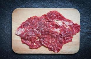Meat beef slice on wooden cutting board for cooked or Sukiyaki Shabu shabu Japanese foods Asian cuisine - Fresh beef raw photo
