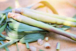 lemon grass and green leaf on wooden background for herbs and vegetable food photo