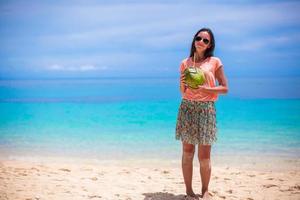 Woman holding a coconut photo