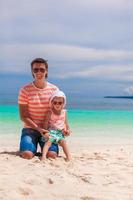 Father and daughter on the beach photo