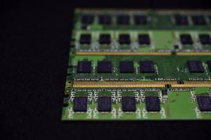 Blue RAM bars on a black background. Computer memory chips. Computer chips. photo
