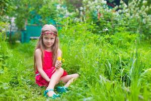 Little girl on the park outdoors photo