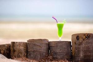 Green drink by the beach photo