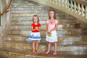 Little sisters on the stairs photo