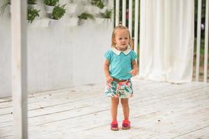 Cute little girl in blue dress photo