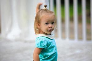 Cute little girl in blue dress photo