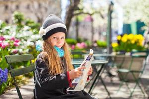 Little girl with a map photo