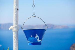 Painted bucket in Santorini, Greece photo