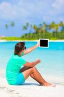 Man with device by the beach photo