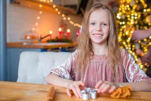 Little girl cooking for Christmas photo
