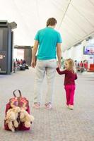 Father and daughter on the airport photo
