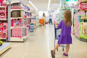 Little girl on the super market photo