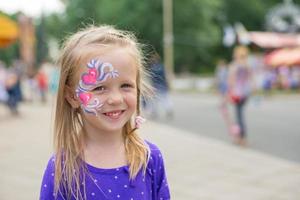 Little girl with face painting photo