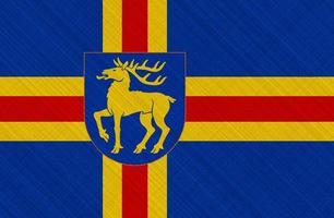 Flag of Aland Islands on a textured background. Concept collage. photo