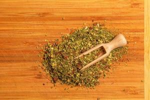 Background of natural green tea with mint, lemon balm, hibiscus and berries. Texture of green tea. Top view, flat lay. photo