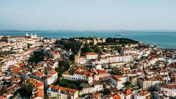 Aerial drone view of St. George Castle in Lisbon, Portugal with surrounding cityscape photo