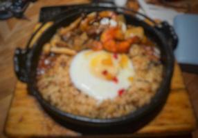 Defocused blurry photo of hot plate japanese fried rice