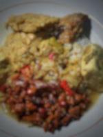 Defocused blurred photo of typical Javanese food, smoked fish mangut rice with orek tempeh added.