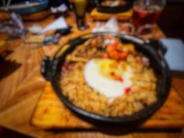 Defocused blurry photo of hot plate japanese fried rice