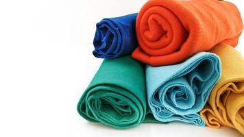 assorted colors of cotton fabric rolls for t-shirts photo