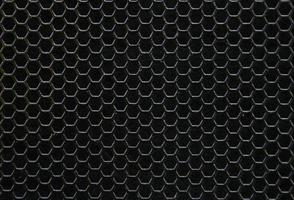 Black iron hexagonal texture. Industrial background photo