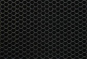 Black iron hexagonal texture. Industrial background photo