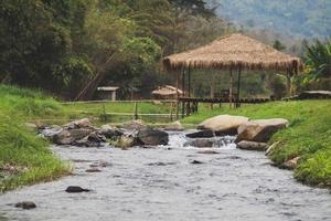 Stone and river at Utaradit, Thailand. photo