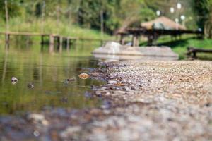 Stone and river at Utaradit, Thailand. photo