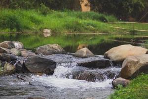 Stone and river at Utaradit, Thailand. photo